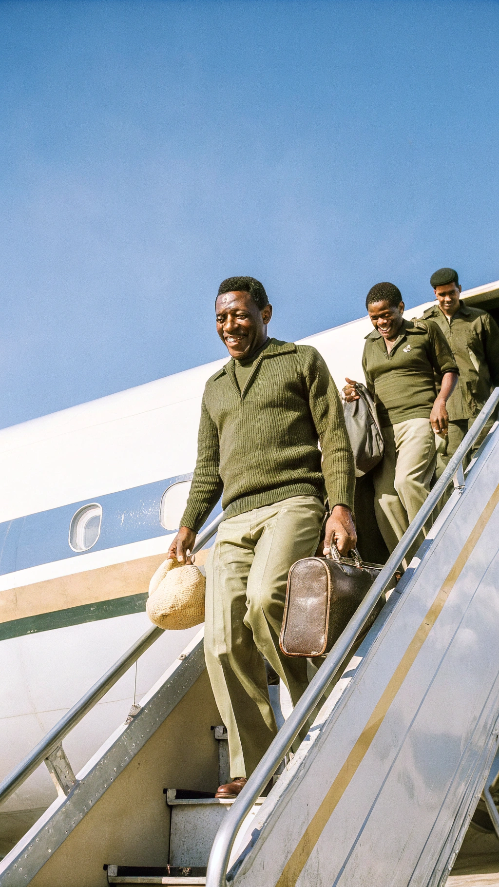 AI generated image by Red Panda AI: Pelé in a classic 1960s Santos FC jersey, smiling and walking off a plane with teammates, holding a football, warm colors, hopeful mood, vintage photograph style